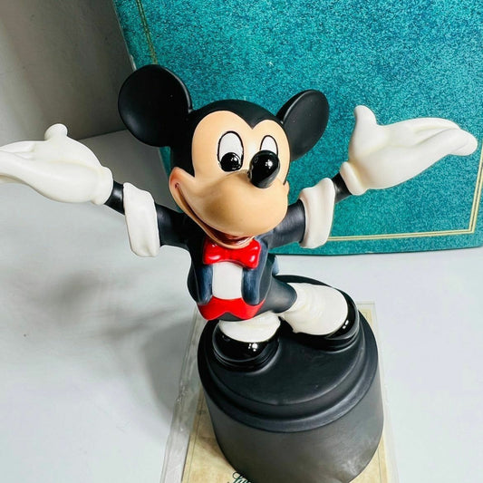 a figurine of a mickey mouse on a table