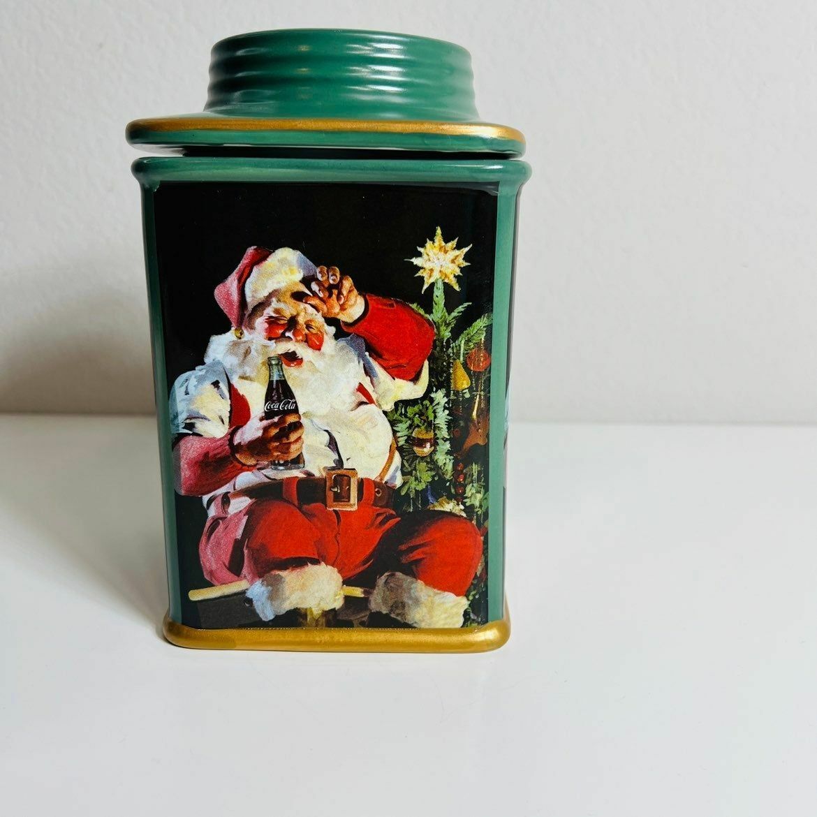 a canister with a picture of santa claus on it
