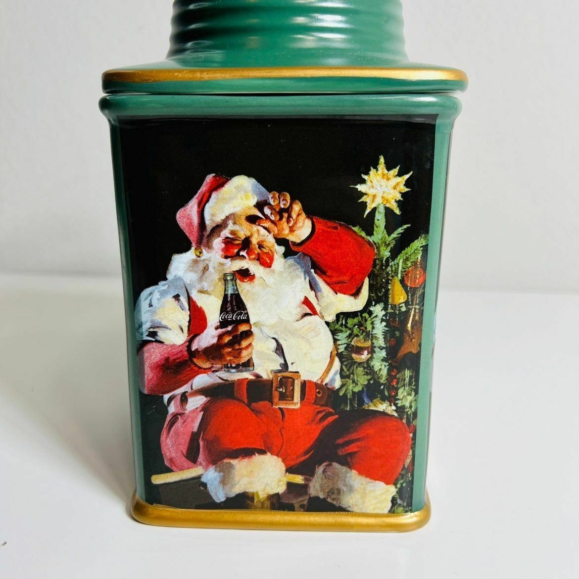 a canister with a picture of a santa clause on it