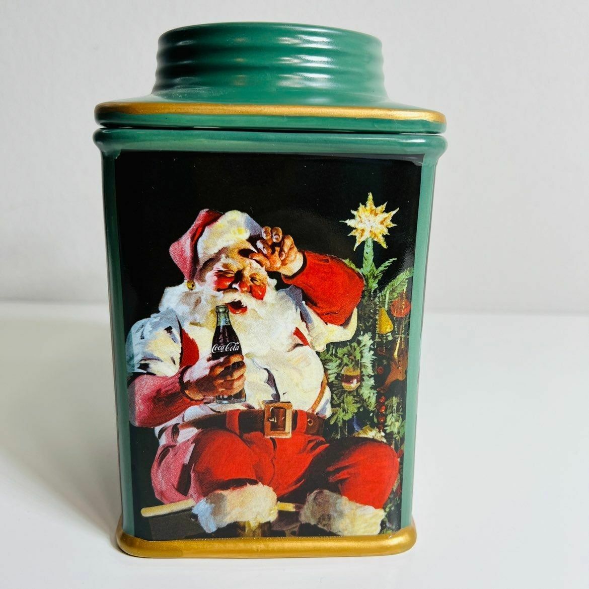 a canister with a picture of a santa clause on it